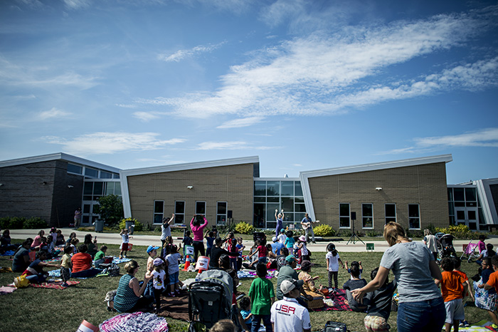Exterior of building with families at picnics